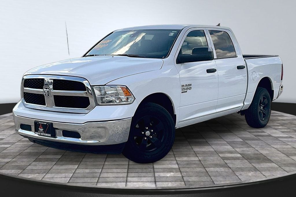 2023 RAM 1500 Classic SLT in Bright White Clearcoat — front three-quarter view
