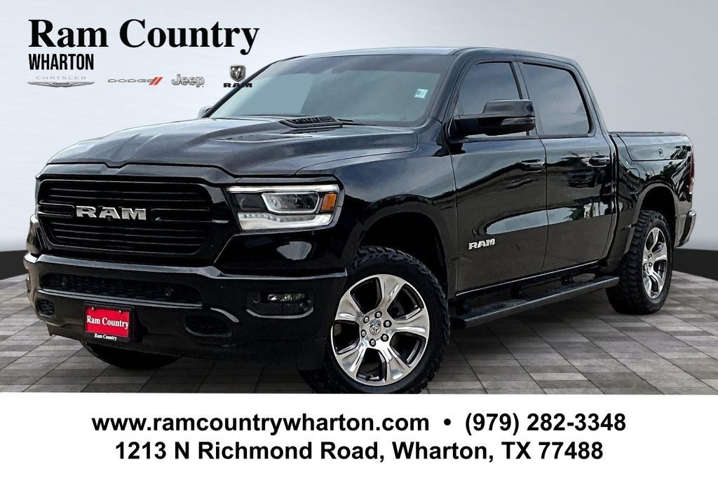 2024 RAM 1500 Laramie in Diamond Black Crystal Pearlcoat — front three-quarter view